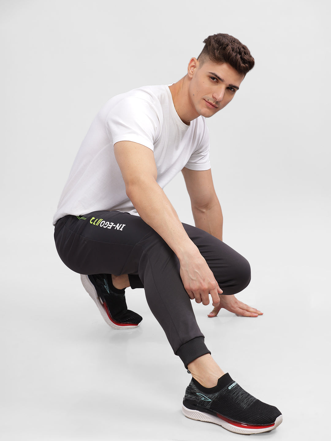 INEGO Men Casual Stretch Joggers Luxury Polyester Interlock Fabric HD Print at the Side Contrast Zipper Pocket Regular Fit Dark Grey Solid Size M (Dark Grey, Grey Melange, Maroon, Navy, Black) Inego #color_Charcoal